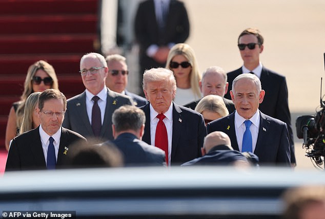 Israel's Prime Minister Benjamin Netanyahu (R) and President Isaac Herzog (L) welcome President Trump (C) at Ben Gurion Airport on the outskirts of Lod near Tel Aviv on October 13, 2025, on the first leg of his trip to Israel and Egypt. Trump is passing through Israel, addressing parliament and meeting with hostage families before heading to Egypt's Sharm El-Sheikh for a major peace summit, where a 'document ending the war in the Gaza Strip' is expected to be signed