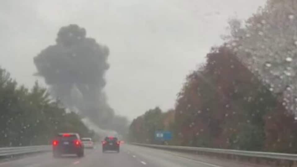 Plumes of smoke seen above Interstate 195 after jet crashes onto a(02)