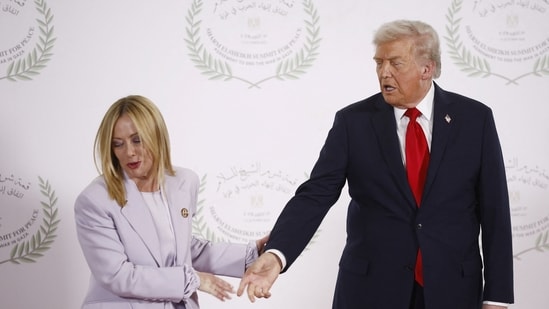 Italian Prime Minister Giorgia Meloni leaves after posing for a photo with US President Donald Trump, at a world leaders' summit on ending the Gaza war.