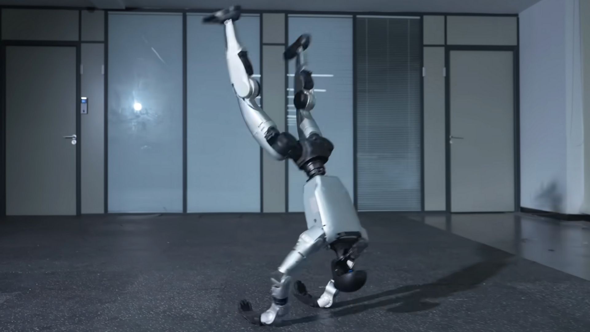 video-china-s-humanoid-robot-wows-with-crazy-kung-fu-moves-balanced