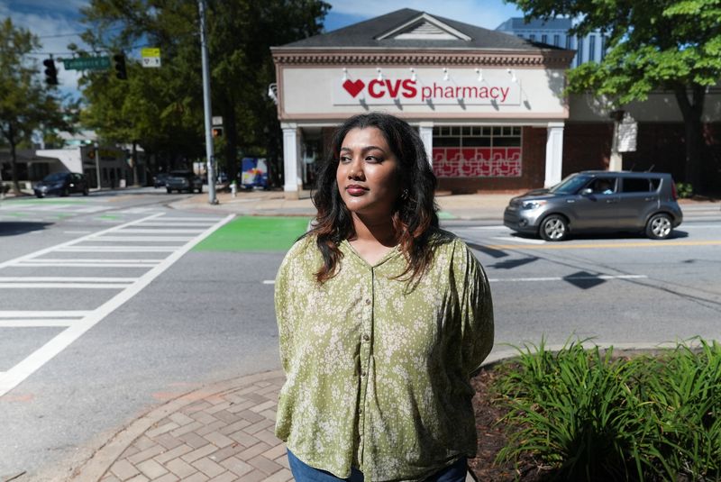 Nadia Hicks, 31, stands outside a CVS Pharmacy in Atlanta