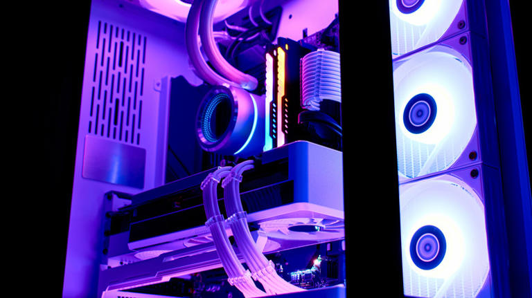 A desktop pc with purple LEDs.