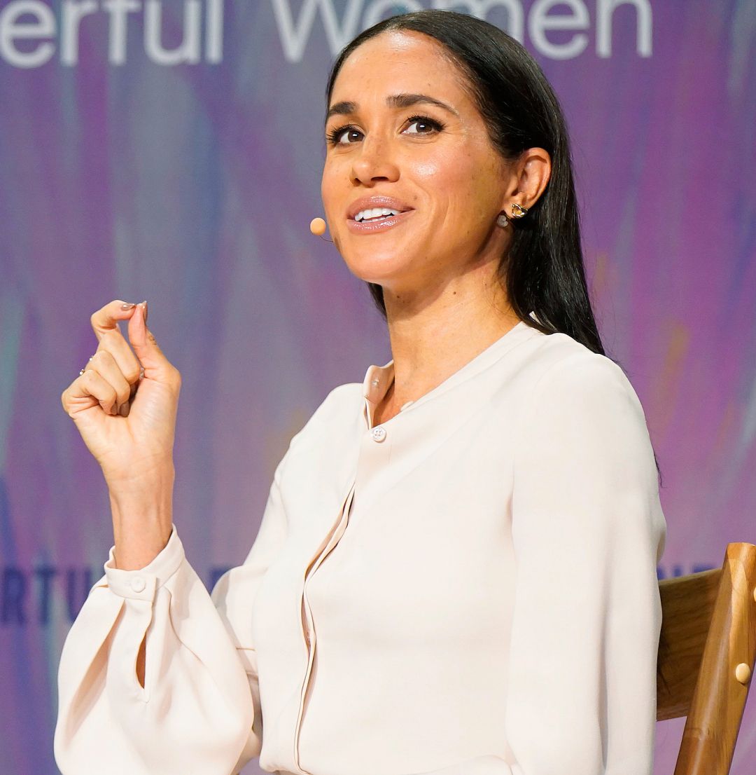 Meghan Markle Talks Business in an Ivory Blouse and Leather Pencil