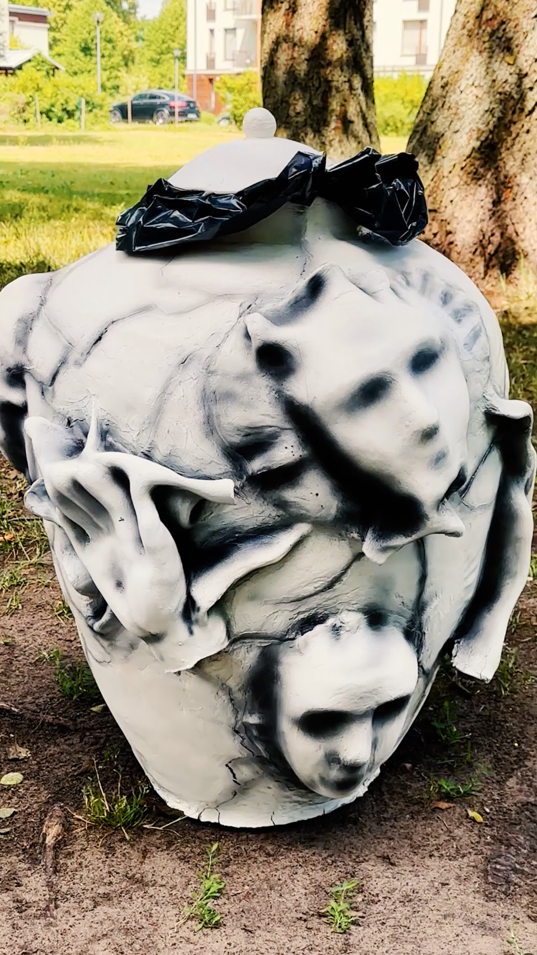 Watch how we turned a local trash bin into a spooky urn!