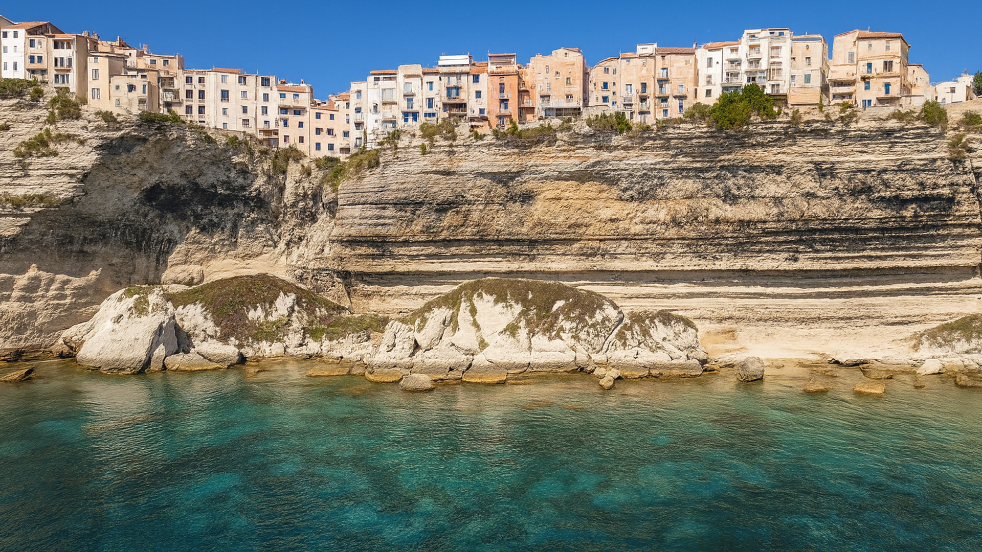 Bonifacio – France – Buildings on Cliffs Above Clear Blue Sea in 4K