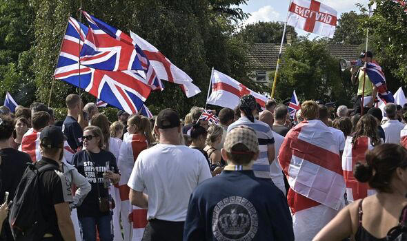Chaos in UK town as machete thugs rip down England flags - ‘We don't ...