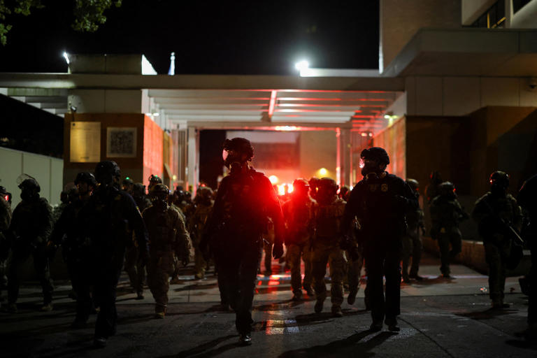 The driver of the ambulance told 911 dispatchers that agents were blocking their path to leave, not protesters (REUTERS)
