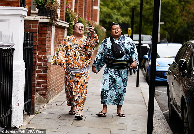 Sumo wrestlers recreate iconic image of the Beatles before competing at ...