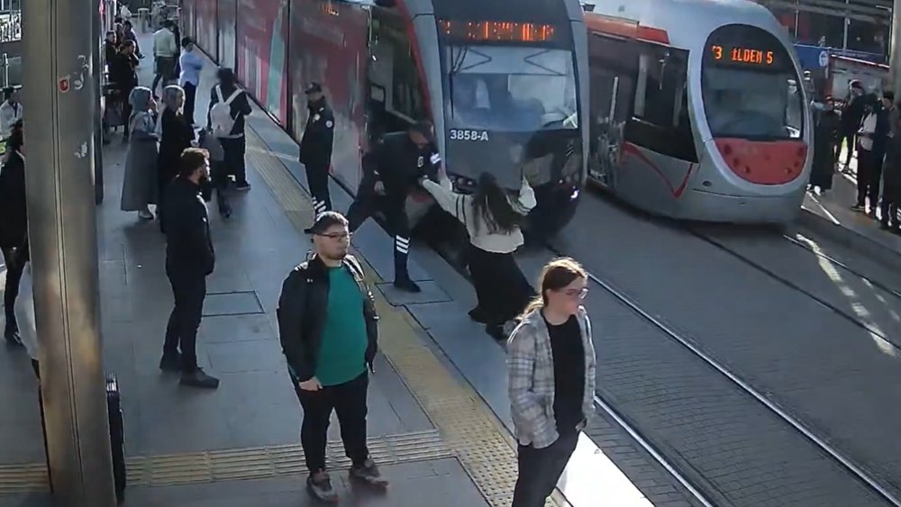 At the last second security guard saves woman from tram