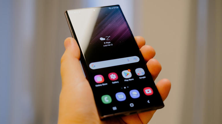 Someone holding a Samsung Galaxy S22 phone