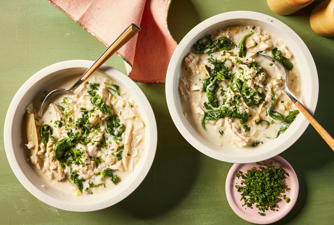 Overhead photo of two bowl of Slowcooker Spinach Artichoke Chicken Soup