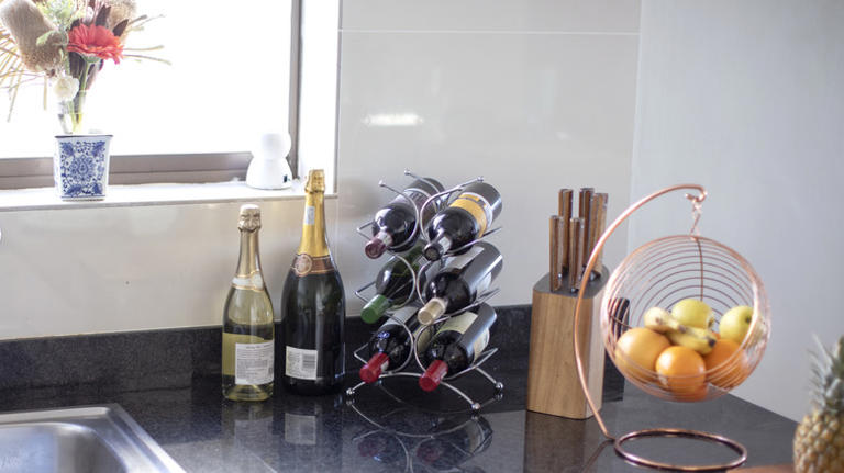 Reuse An Old Kitchen Cabinet To DIY A Wine Rack Like HGTV's Erin Napier Did