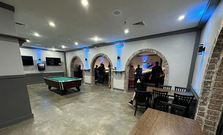 The Drawbridge, a new family-friendly shuffleboard bar, aims to bring ...
