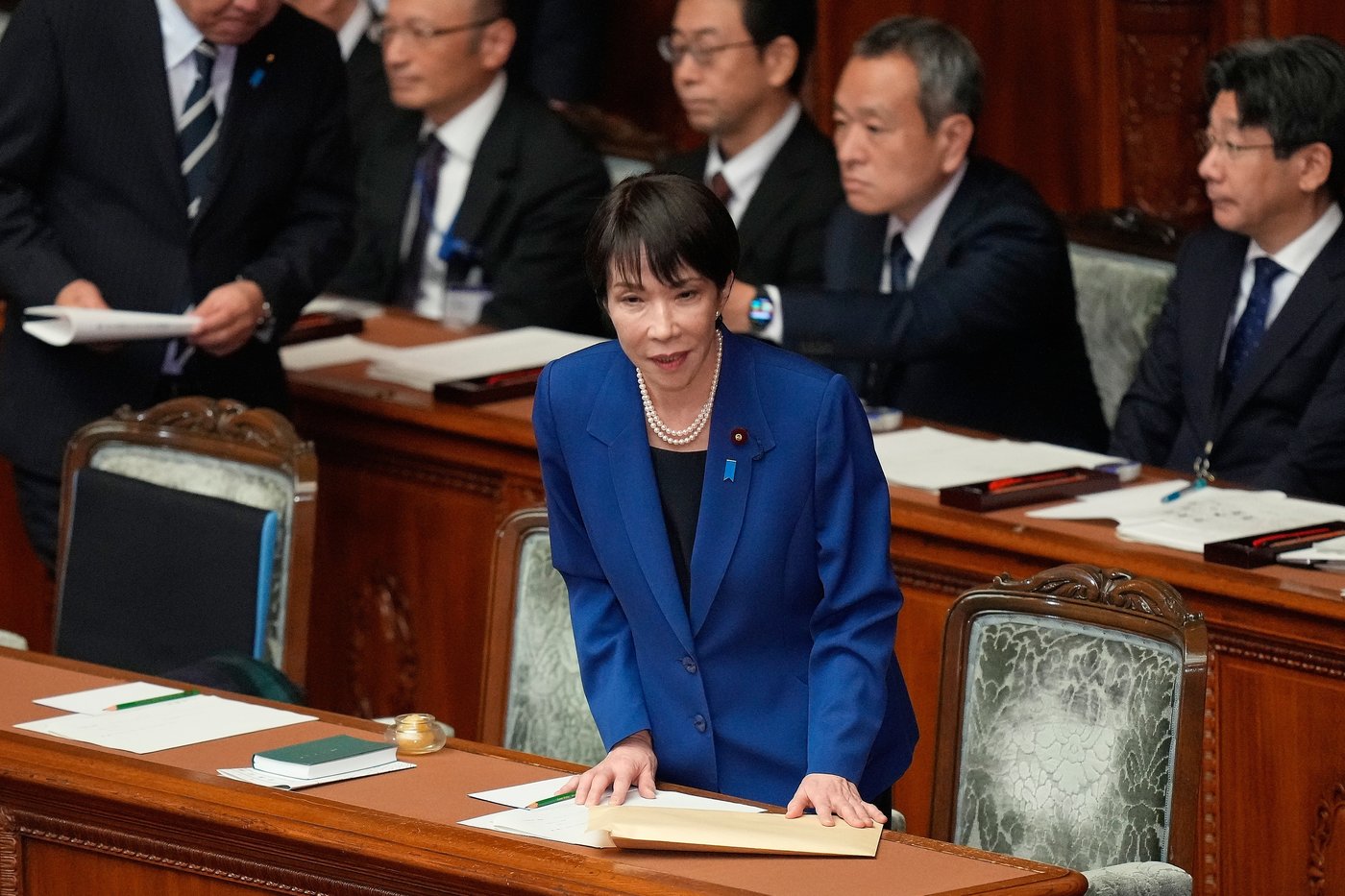 Japan's Prime Minister Sanae Takaichi bows before delivering a policy speech at the extraordinary session of parliament's lower house Friday, Oct. 24, 2025, in Tokyo. (AP Photo/Eugene Hoshiko)