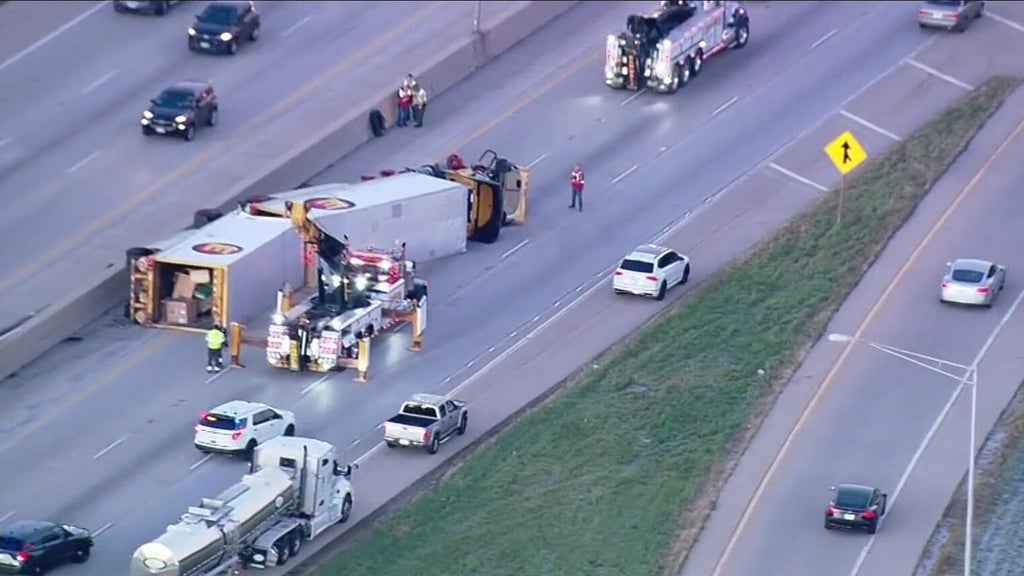 Semi truck rollover crash causing delays on I-80