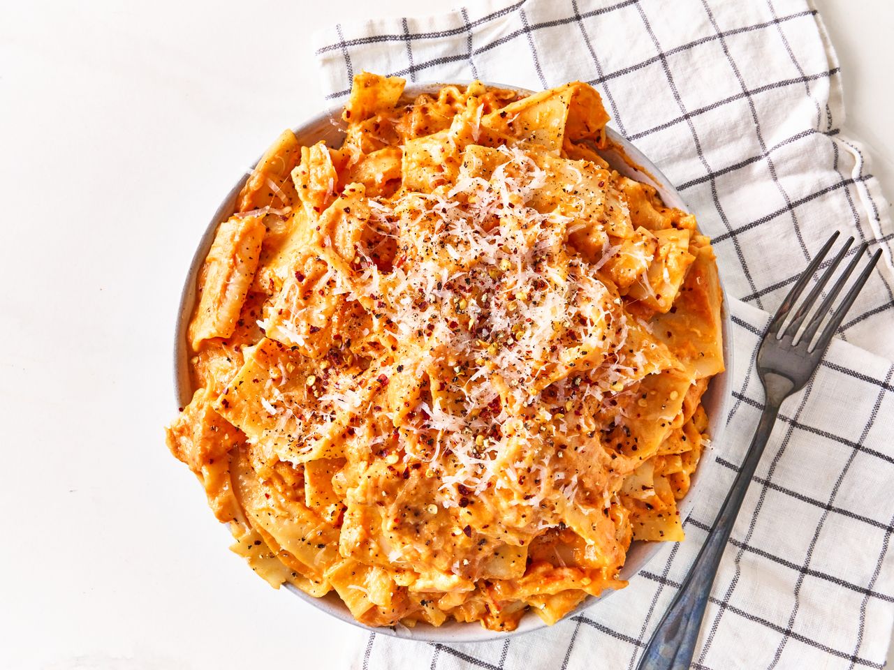 Lasagna sheet pasta with tomato sauce and cheese on plate