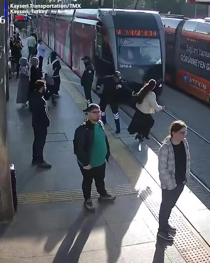 VIDEO: Woman saved from oncoming train