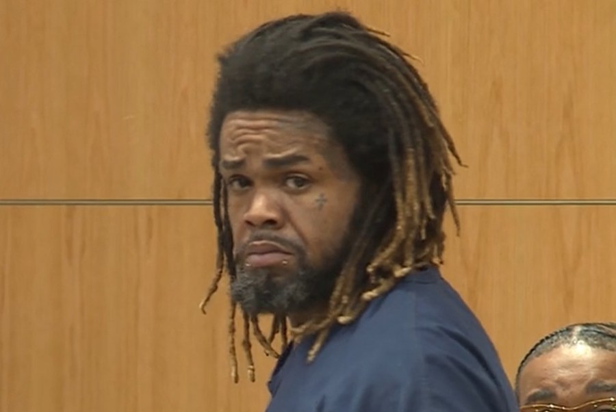 Man charged with double murder back in court