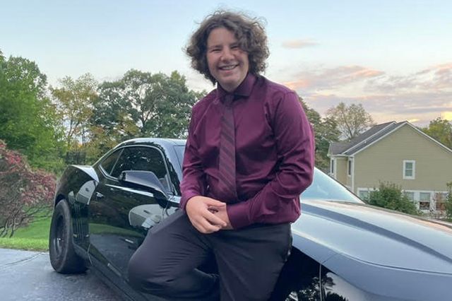 Courtesy of Lori Walton Deegan Walton in front of a car