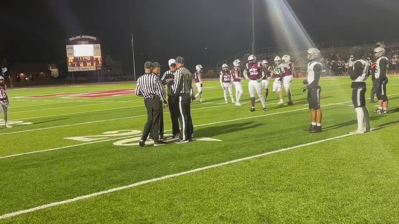 Referees talking and reversing a call from an interception to a ...