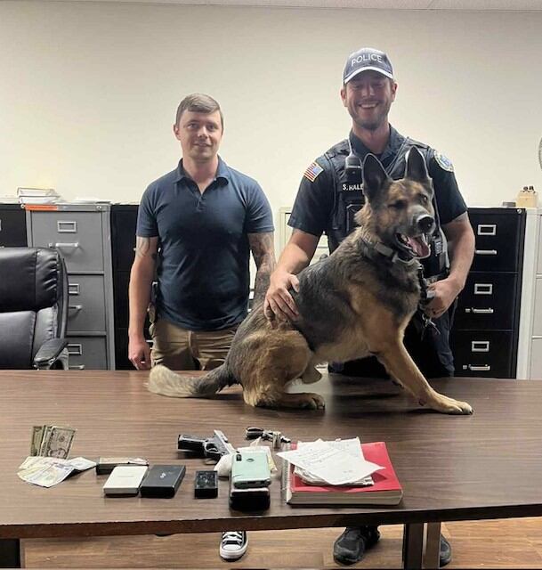 Pair arrested after police K-9 helps locate drugs, guns in car carrying ...