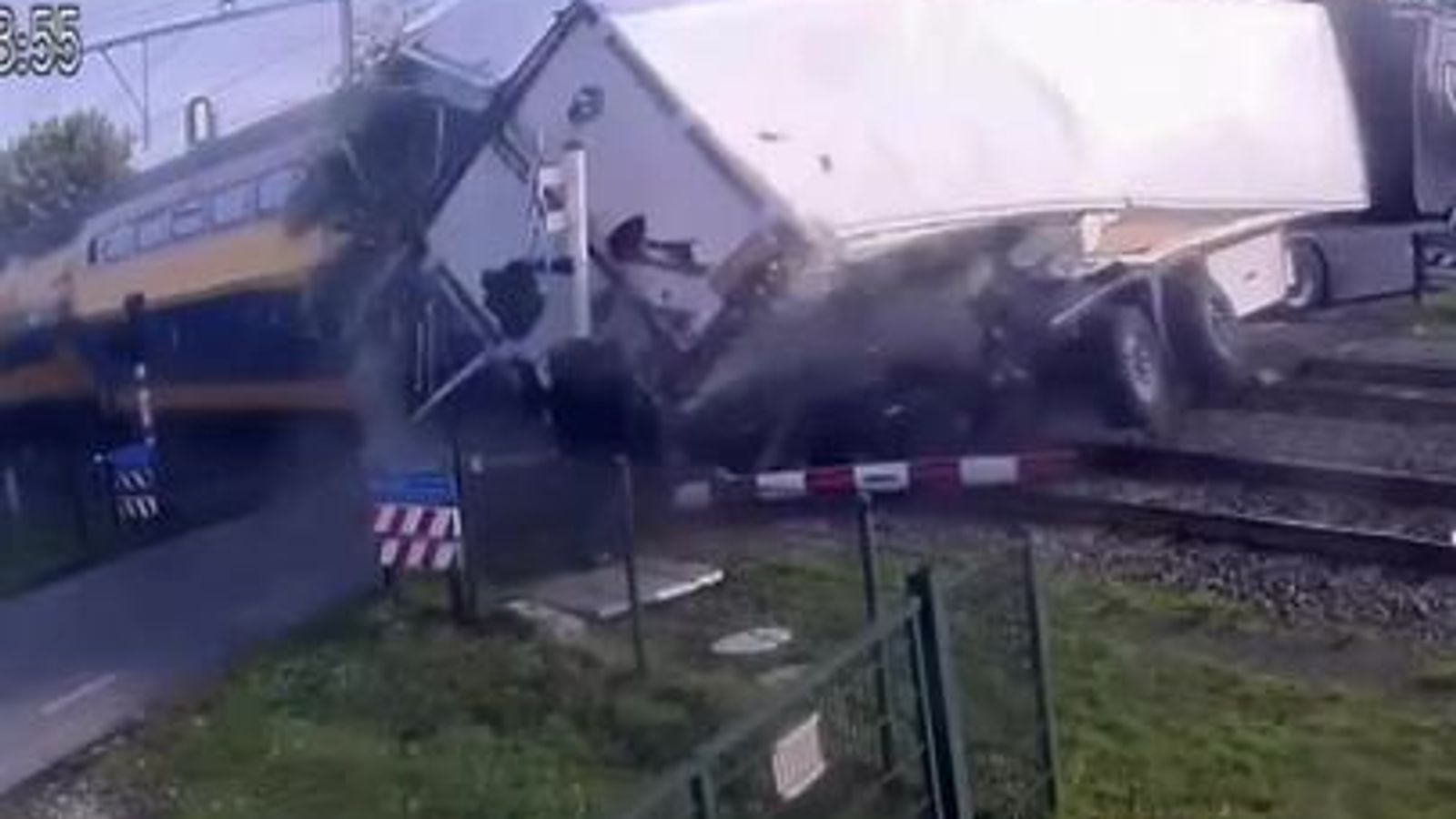 Moment train smashes into truck full of pears