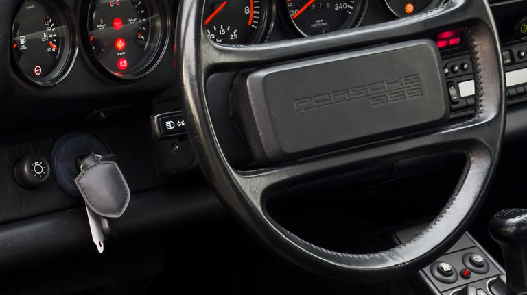 Why do Porsches have the ignition on the left?
