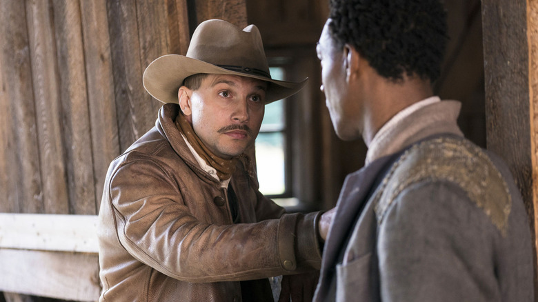 Logan Marshall-Green as Creeley Turner wearing a cowboy hat in Damnation