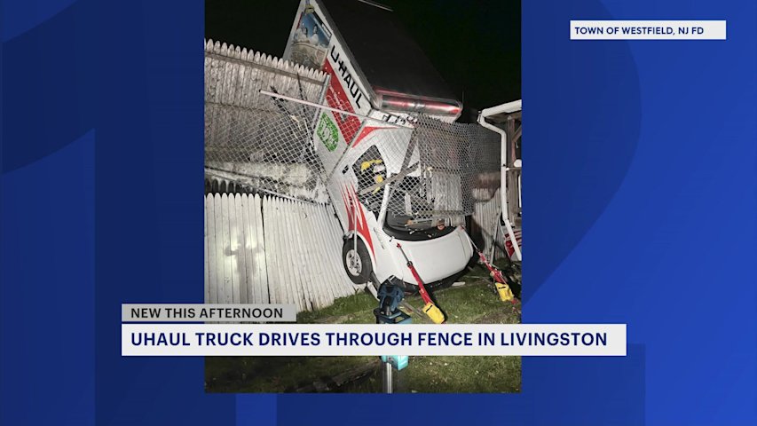 U-Haul truck crashes through fence in Westfield