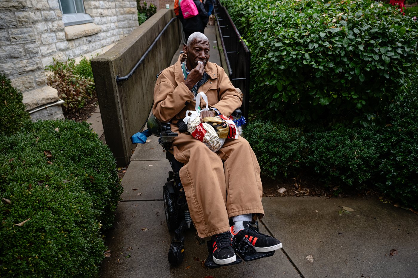 FILE - Brock Brooks, a disable Marine Corps veteran, cries while describing the impending SNAP shutdowns while waiting in line to enter the food pantry service at Calvary Episcopal Church on Oct. 30, 2025, in Louisville, Ky. (AP Photo/Jon Cherry, file)