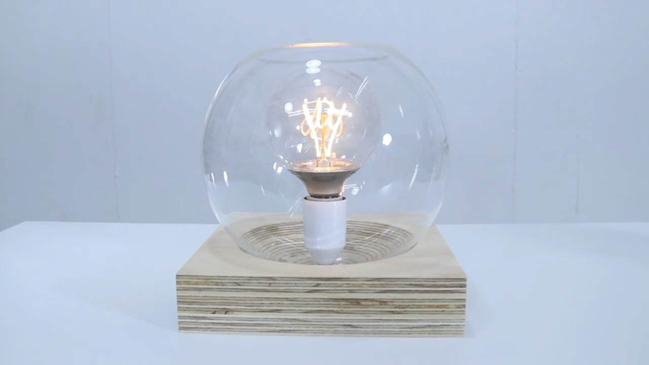 Image showcasing How anyone can build a globe lamp with a sculpted base for minimal cost