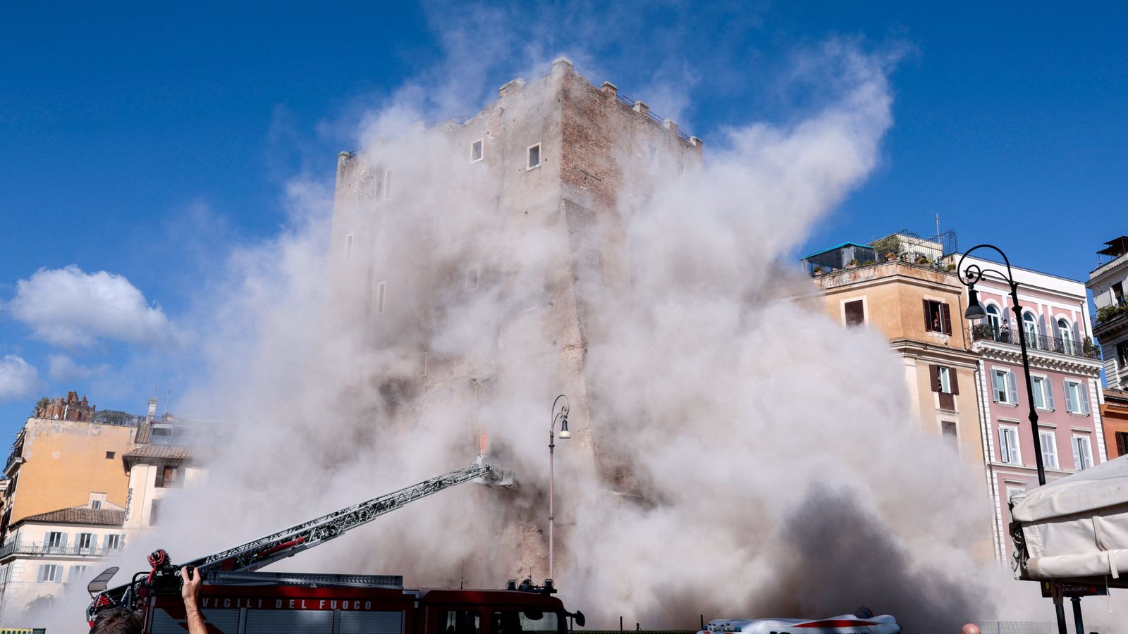 Worker trapped under collapsed medieval tower for 11 hours dies