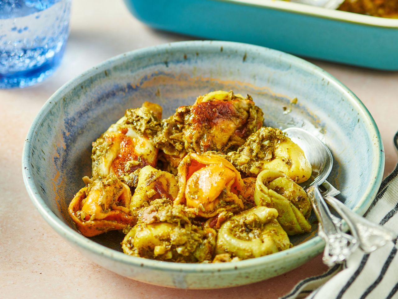 A bowl of pesto tortellini