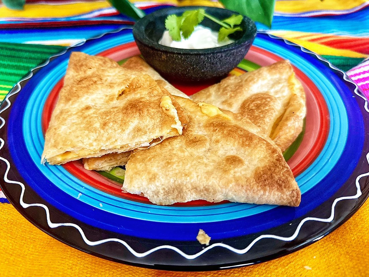 quesadilla triangles on colorful plate