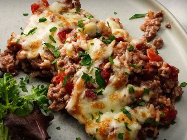 close up of piece of Cheesy Hamburger Rice Casserole