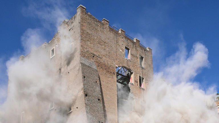 Worker trapped for 11 hours after collapse of medieval tower in central ...