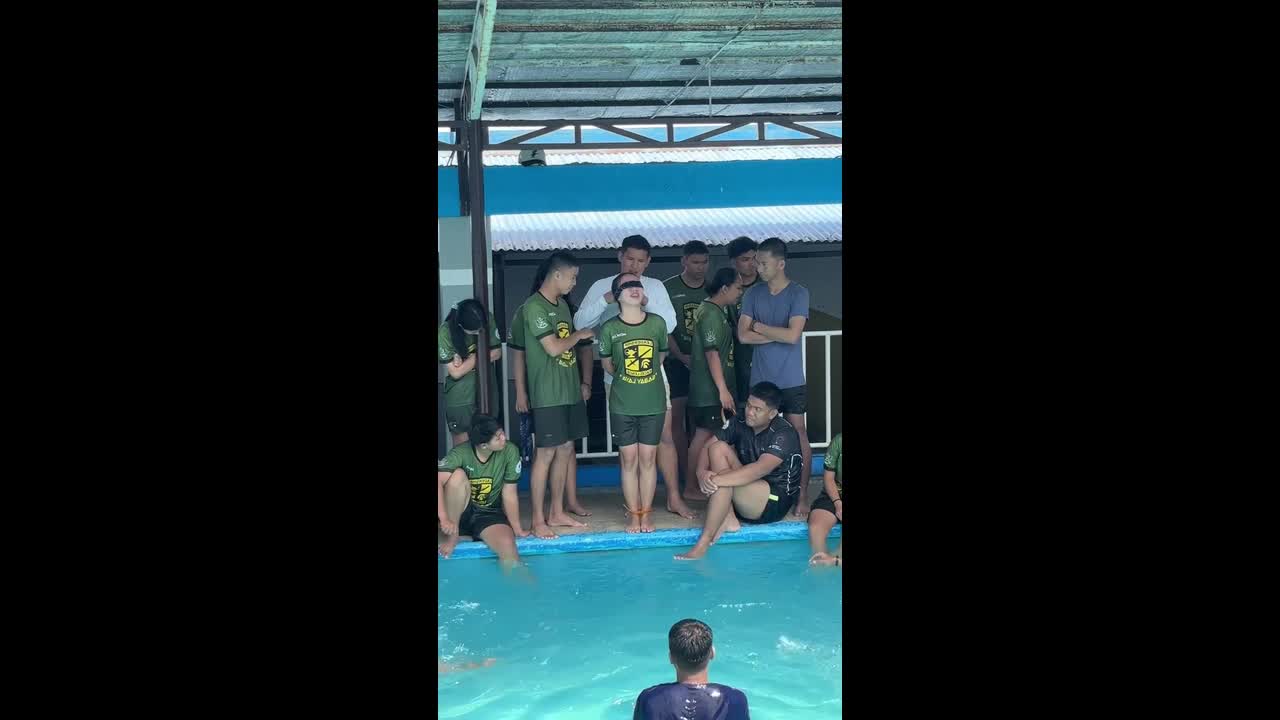 Girl panics during water survival training being thrown into pool tied ...