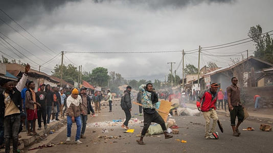 People protest in the streets of Arusha, Tanzania, on Thursday, Oct. 30, 2025.