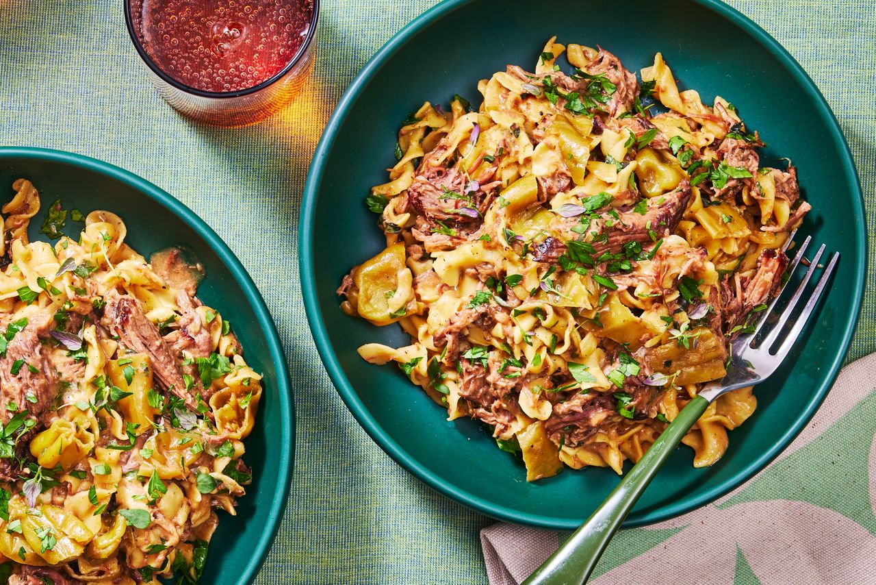 Slow Cooker Mississippi Noodles in a green bowl ready to serve