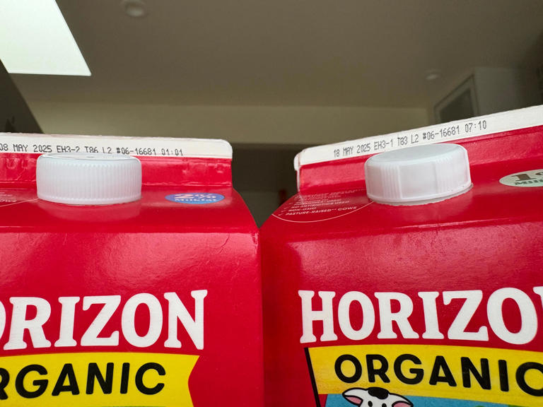 Get a grip. New, taller milk carton caps are easier to grasp, twist
