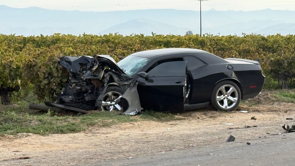 One dead after Dodge Challenger crashes into back of turning semi