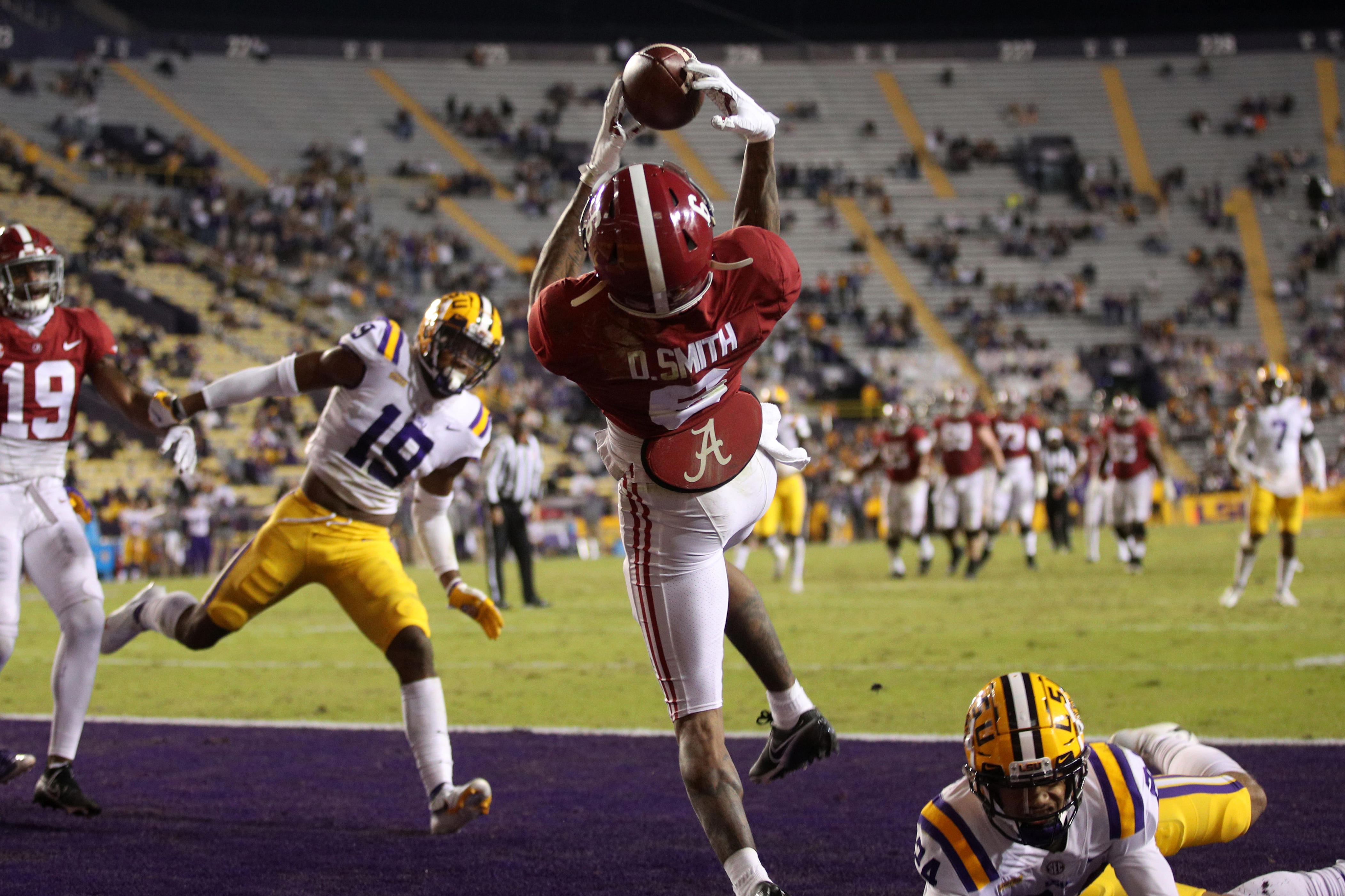 BATON ROUGE, LOUISIANA - DECEMBER 05: DeVonta Smith #6 of the Alabama Crimson Tide catches a touchdown pass against the LSU Tigers at Tiger Stadium on December 05, 2020 in Baton Rouge, Louisiana. (Photo by Chris Graythen/Getty Images)