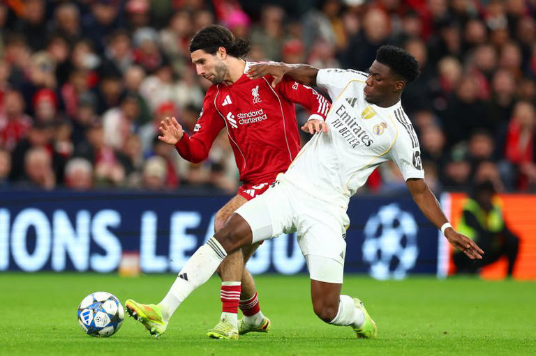 Dominik Szoboszlai battles with Aurelien Tchouameni during Liverpool vs Real Madrid