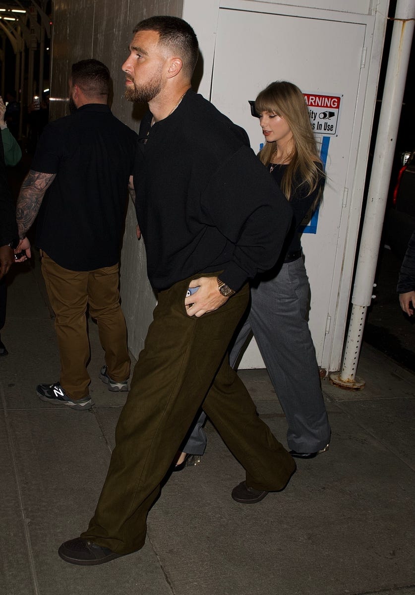 Travis Kelce and Taylor Swift arriving at Polo Bar in NYC