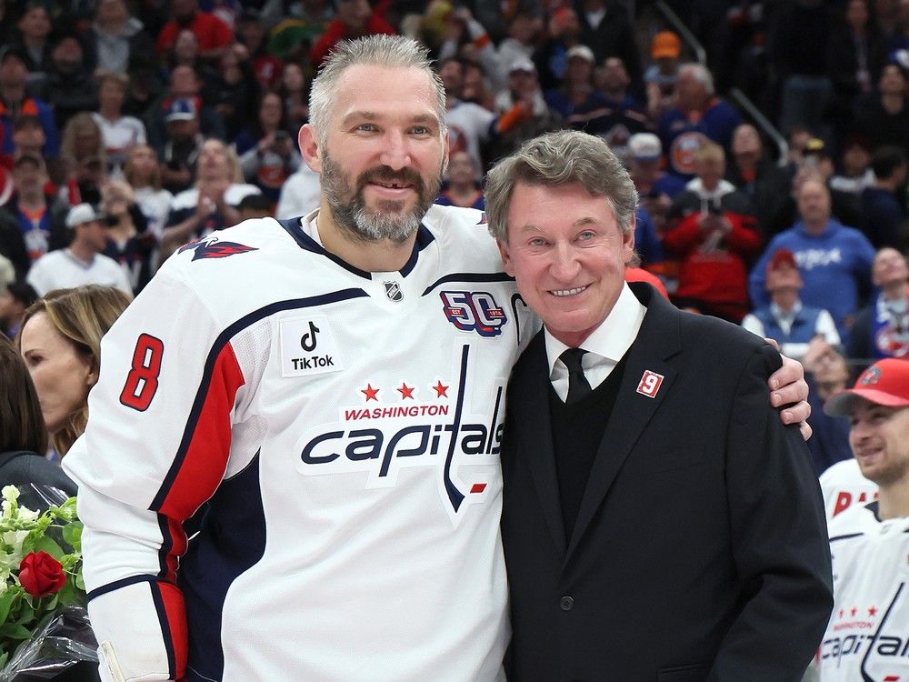 Wayne Gretkzy, right, was on hand when Alexander Ovechkin broke his 31-year NHL goal-scoring record in April 2025. The Great One jokingly offered that night to buy the Great 8 a car if he was able to notch 900 career goals, a feat he accomplished Wednesday in Washington.