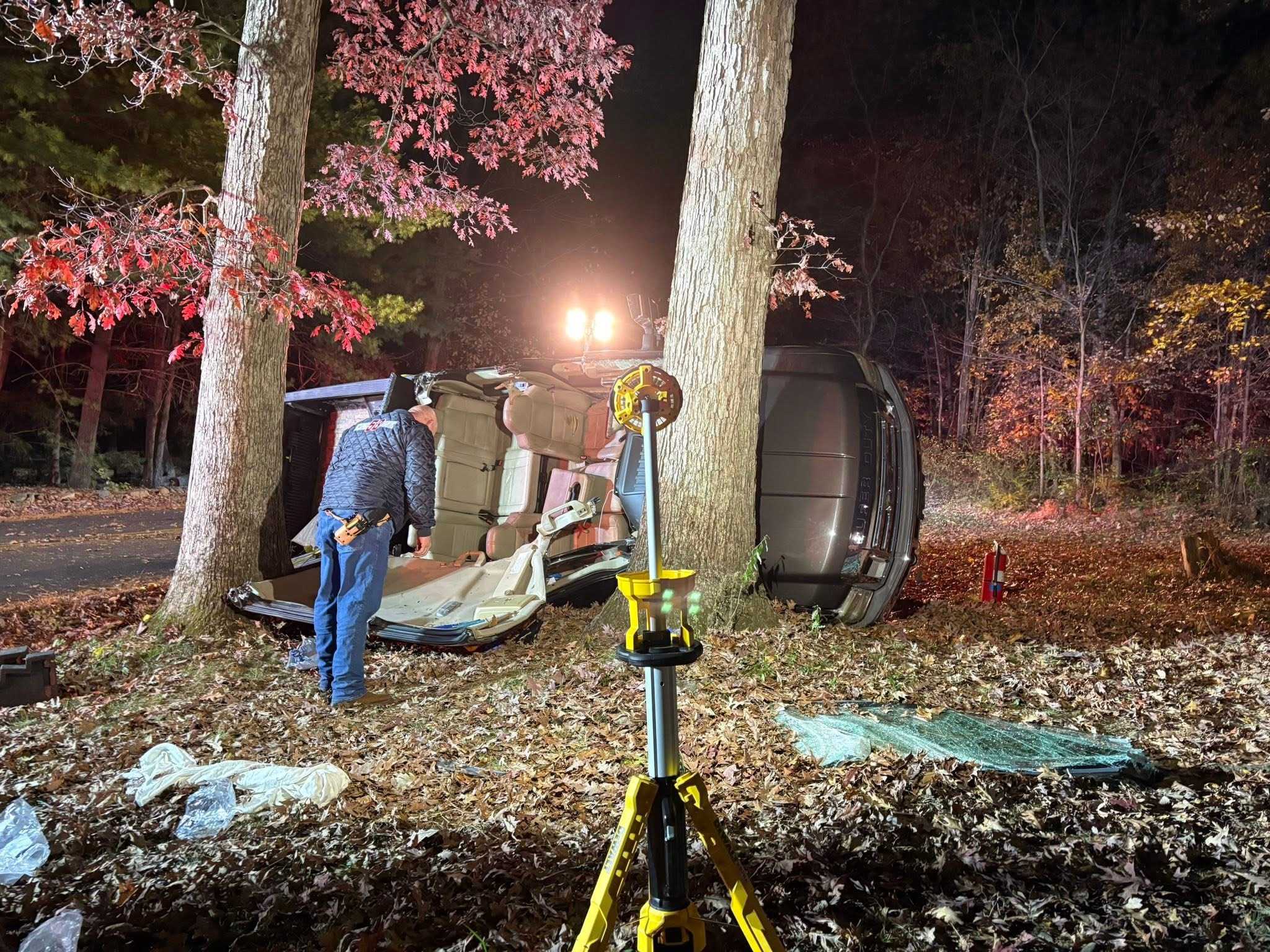 Crews cut roof off truck to free trapped driver before helicopter ...