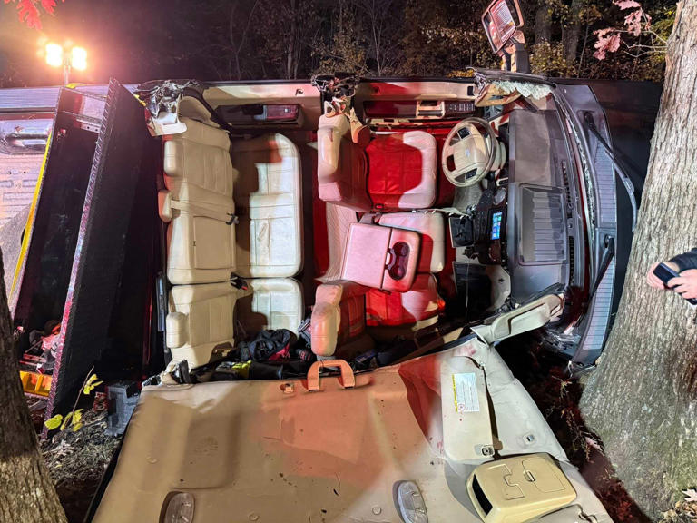 Crews cut roof off truck to free trapped driver before helicopter ...