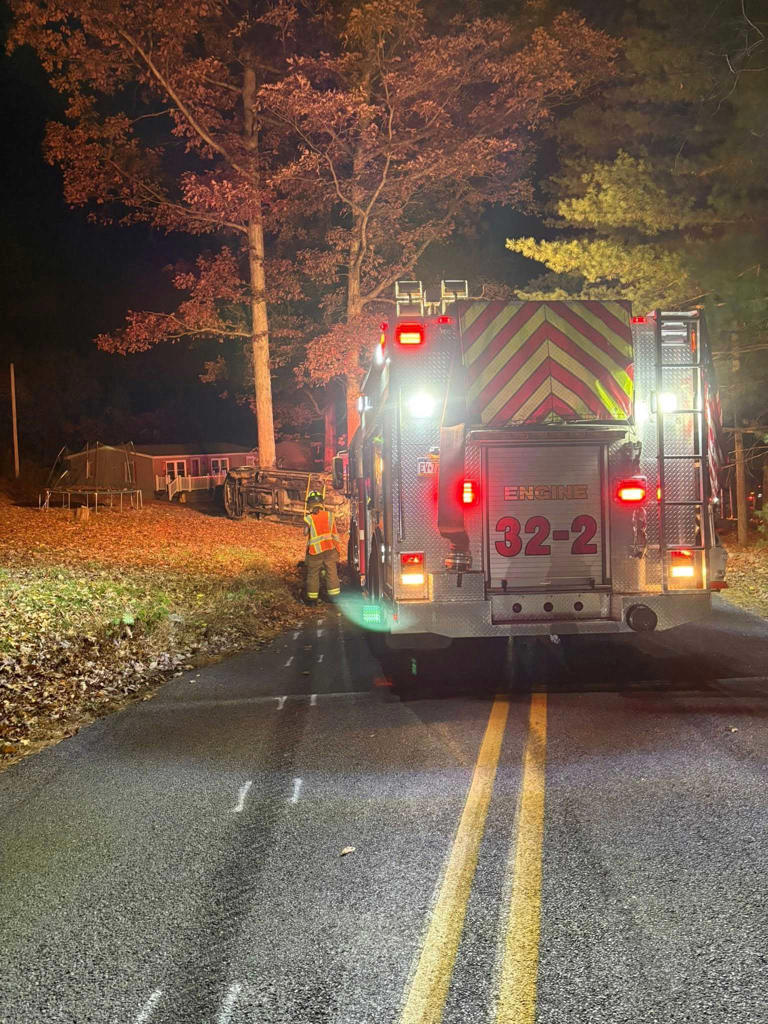 Crews cut roof off truck to free trapped driver before helicopter ...