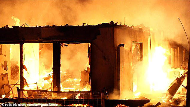 Distraught NBA coach watches on helplessly as his home burns to the ...