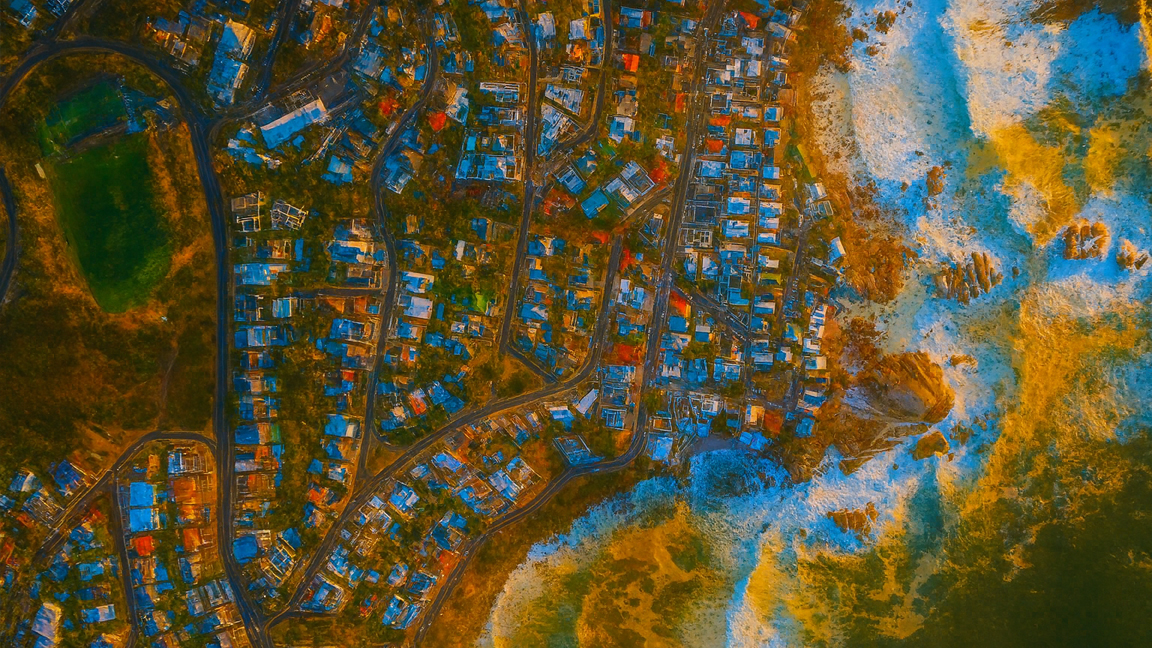 Aerial View of Coastal City – Ocean Meets Urban Life